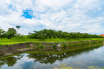Goryokaku Tower in summer sunny day white clouds and bule sky. The tower observatory decks command the entire view of Goryokaku Park, the beautiful star shaped fort. Hakodate City, Hokkaido, Japan