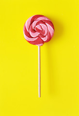 Delicious candies on colorful background.