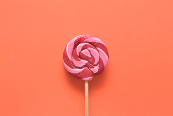 Delicious candies on colorful background.