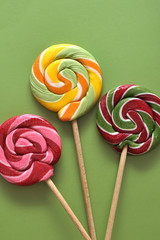 Delicious candies on colorful background.