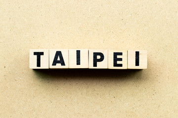 Obraz premium Letter block in word Taipei on wood background
