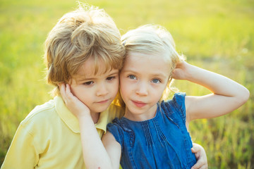 Summer portrait of happy cute child. Happy Kid on summer field. Lovely children. First love. Child playing Happy childhood. The concept of child friendship and kindness. Sweet angel children.