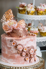 Party decorations; Candy table, table with various sweets and cakes.