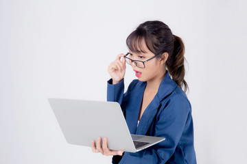 Beautiful portrait young asian business woman holding laptop computer isolated on white background, businesswoman looking notebook with surprise and amazing, asia freelance girl work job and wonderful