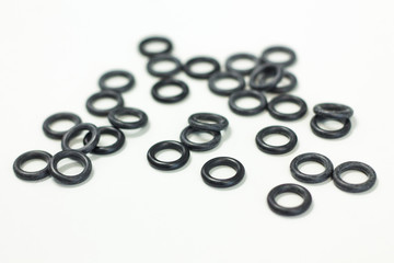 O-ring tool equipment, black O-Rings on white background.
