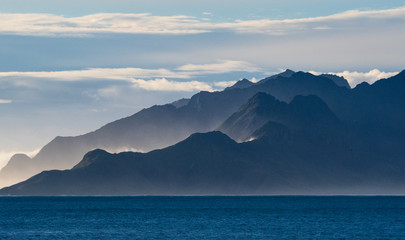 Fototapeta na wymiar South Georgia mountains loom over the Southern Ocean