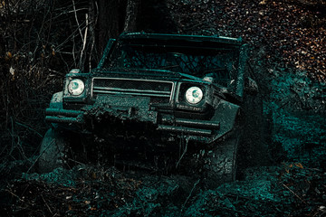Travel concept with big 4x4 car. Best Off Road Vehicles. Off-road vehicle goes on the mountain. Road adventure. Adventure travel. Safari suv. © Volodymyr