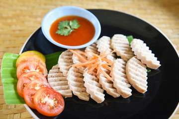 White pork sausage asia - Mooyor in thai fermented pork sausage slice on plate with tomato sauce