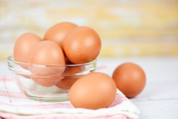 Fresh egg glass bowl on the wooden table background - Raw chicken eggs collect from the farm products natural eggs for food