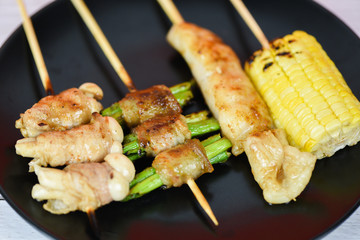 MALA Chinese BBQ - Grilled pork thai asian street food style slice pork with vegetable mushroom corn in skewer sticks grilled on plate with spicy powder chilli