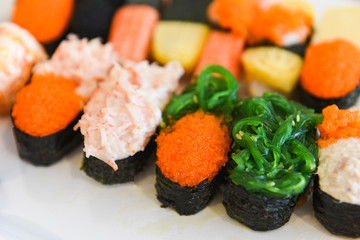 Japanese food sushi roll rice with Tobiko egg Red caviar Cream sauce nori seaweed in the restaurant sashimi sushi menu set Japanese cuisine fresh ingredients mix various types