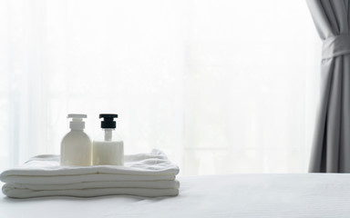 Liquid soap and shampoo bottle in bedroom. Hygiene and healthy life concept.