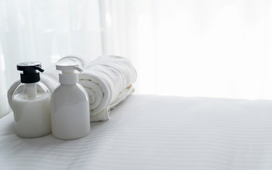 Liquid soap and shampoo bottle in bedroom. Hygiene and healthy life concept.