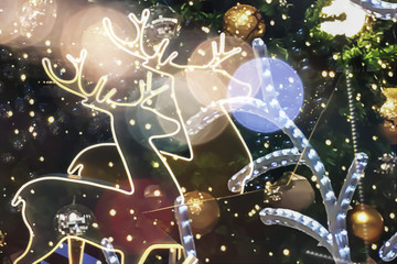 Christmas golden reindeer  festive magic fantasy effect holiday atmosphere with golden shiny ball and christmas tree background.
