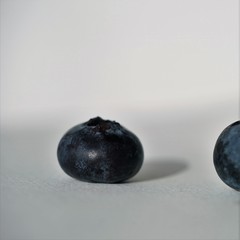 close up view on fresh blueberry on grey background 