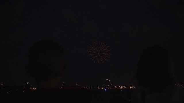 Kids watching fireworks in slow motion.