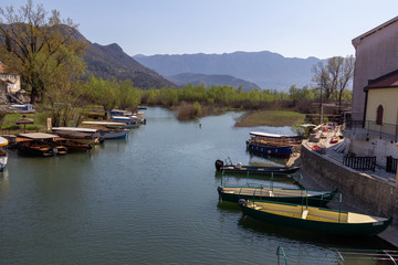 Fototapeta na wymiar Tour boats moored on an inlet of Skadar Lake, Montenegro