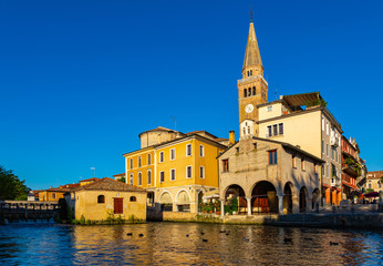 Fototapeta na wymiar Old historical buildings and Lemene river in Portogruaro, Venezia