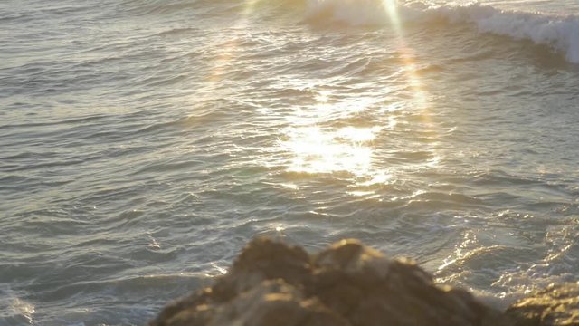 sun hits the water and creating flars