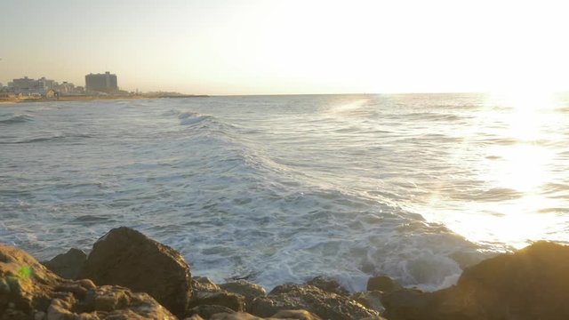 wave moves slowly towards the shore