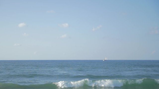 small boat in the horizon