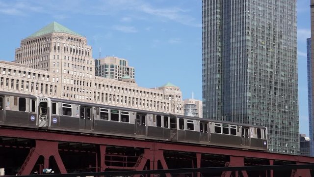 Downtown Chicago, IL view of the cta train and the merchandise mart building - river walk