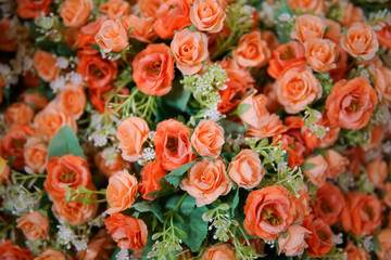 Fake flower and Floral background. rose flowers made of fabric. The fabric flowers bouquet. Colorful of decoration artificial flower