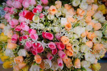 Fake flower and Floral background. rose flowers made of fabric. The fabric flowers bouquet. Colorful of decoration artificial flower