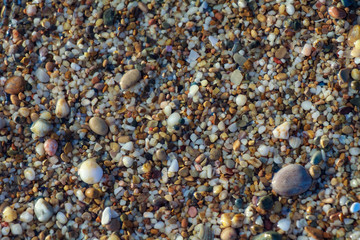 sea pebbles colored granite on the beach