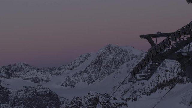 evening light above oetztal mountains with lift mast in foreground