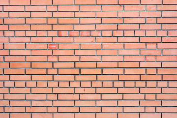 Texture of a brick wall with cracks and scratches which can be used as a background