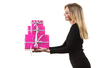 Girl holding stack of pink gift boxes