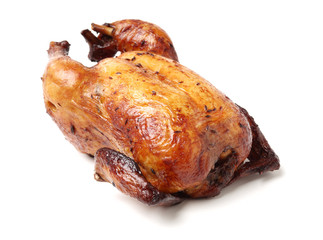 Whole roasted chicken against white background