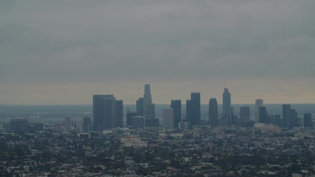 FIXED EST DUSK Establishing shot of Los Angeles Downtown from Griffith observatory. 4K UHD