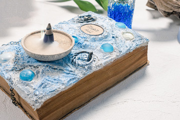 Magic book and ancient keys on a white background.