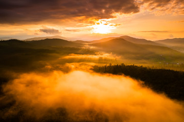 Misty dawn in the mountains. Beautiful landscape