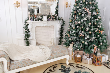 Christmas morning. classic luxury apartments with a white fireplace, decorated christmas tree. Holiday card.