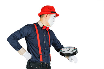 Funny clown with clock isolated on white background.