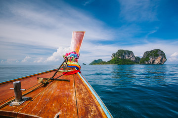 Traditional longtail boat and Poda island, Thailand. 