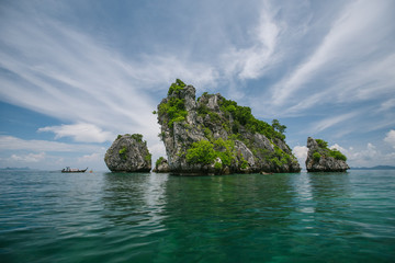 Small limestone island in the ocean, Thailand. 