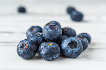 Close up of fresh organic blueberries on white background