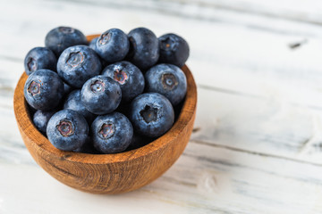Close up of fresh organic blueberries on white background
