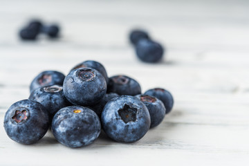 Close up of fresh organic blueberries on white background