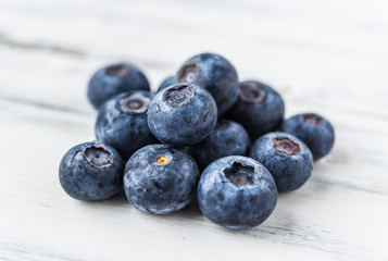 Close up of fresh organic blueberries on white background