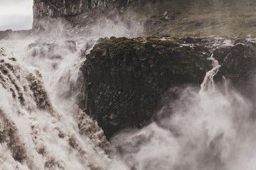 Dramatic view of famous Iceland waterfall Dettifoss. Breathtaking landscape, stream of water, most powerful waterfall in Europe.