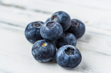 Close up of fresh organic blueberries on white background