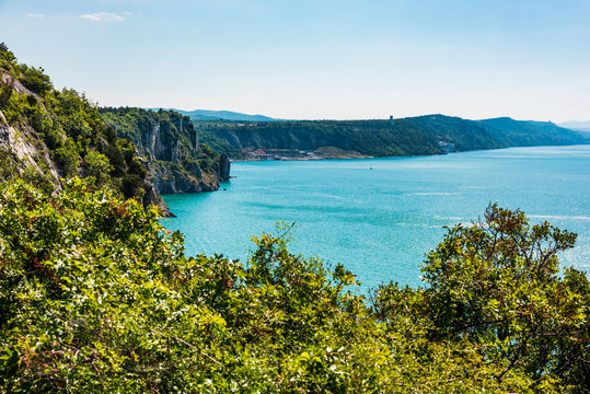 Gulf of Trieste. High cliffs Between boats, karst rocks and ancient castles. Duino. Italy