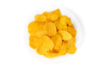 Potato chips in a white plate isolated on white background . Top view