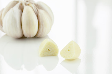 Closeup of garlic on white background, side view