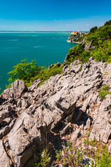 Gulf of Trieste. High cliffs Between boats, karst rocks and ancient castles. Duino. Italy